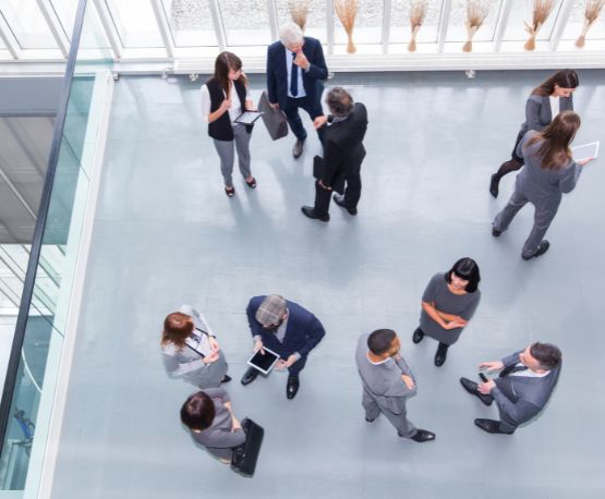 Group of people talking while standing up